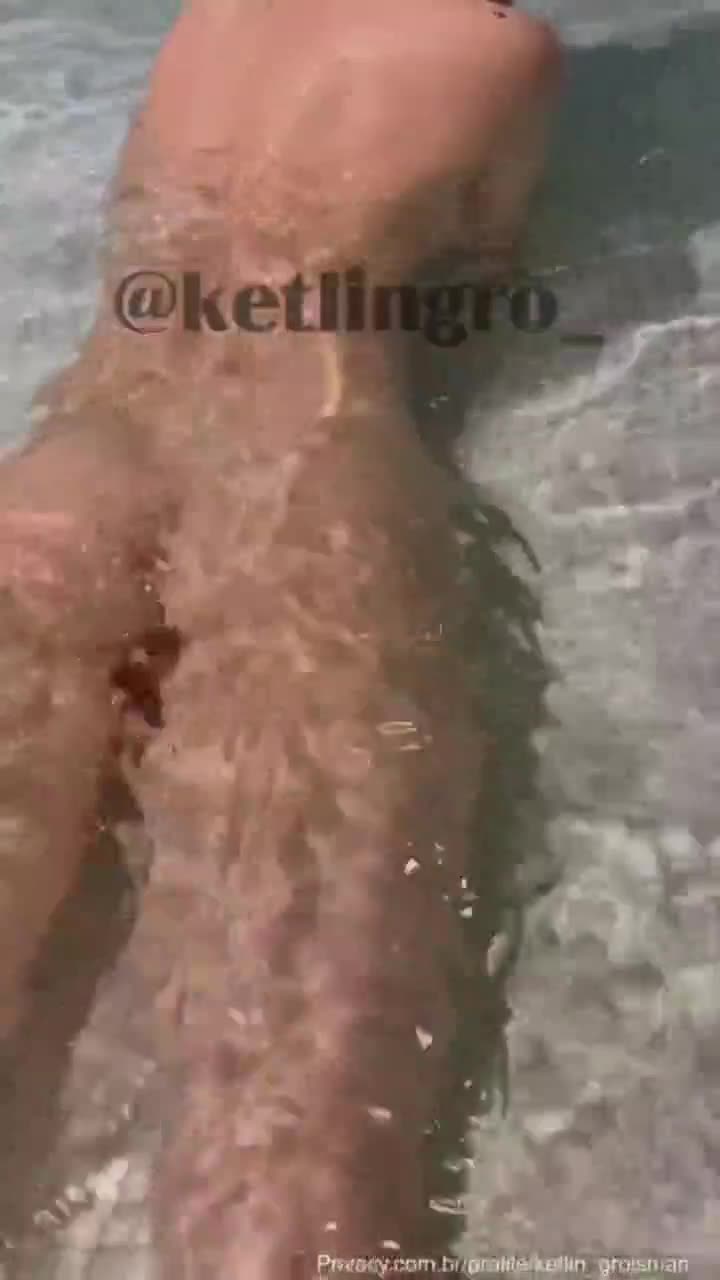 Young man without clothes in the bathtub showing the big tits playing