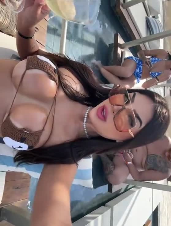 Bolzani videos, a brunette with big tits, using bikini