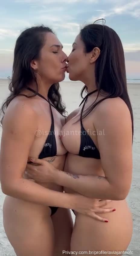 Isa, the naughty traveler, is there on the beach giving a deal on her friend's big tits!