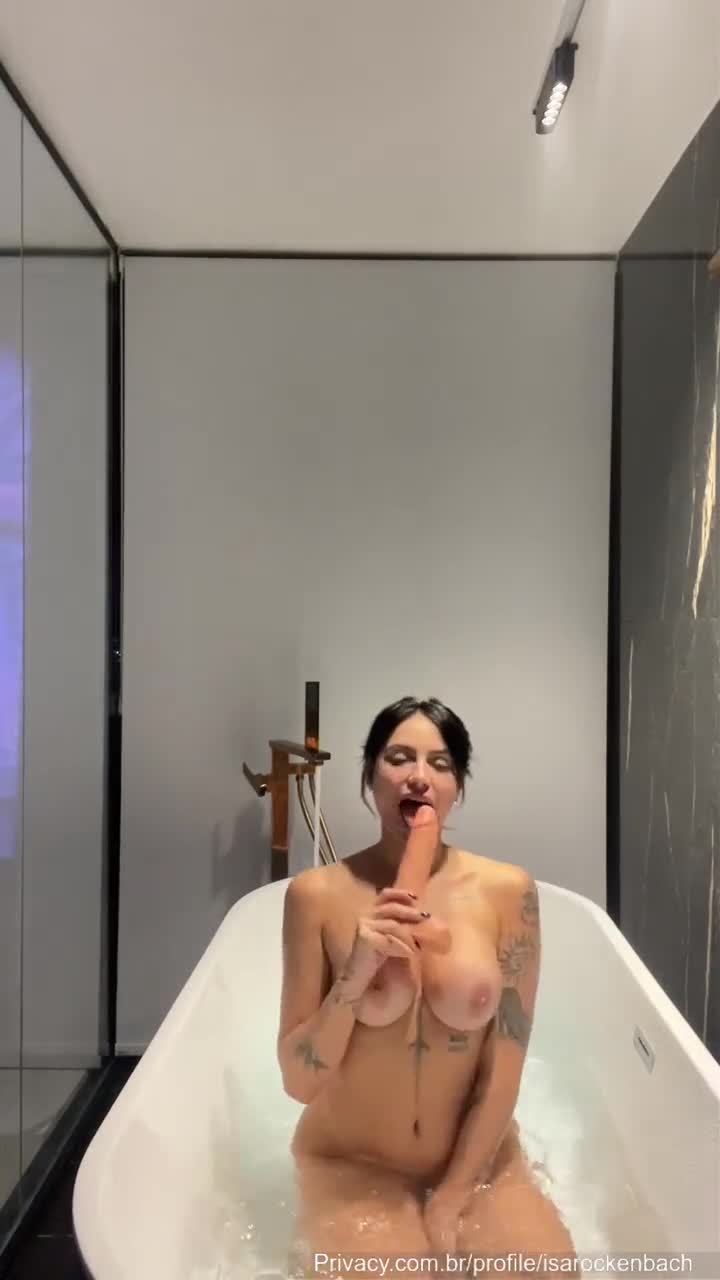 Isadora Rockenback, naked, taking a beating of rubber stick in the face